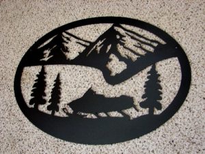 Large Black Iron Oval Snowmobile Mountain Scene Wall Hanger