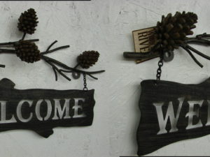 High Country Lodge Pinecone Iron Welcome Sign