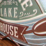 Rustic Metal Tin Embossed Welcome to the Lake House Canoe Paddle Cabin Sign - Image 2