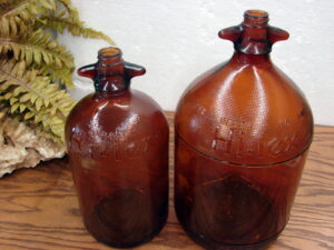 Matching Set/2 Vintage Amber Brown Glass Hi-lex Bleach Jugs 1/2 and 1 Gallon