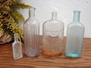 4 Old Dug Bottles Dr Peter Rawleigh's 1 Oz Sized Antique Glass